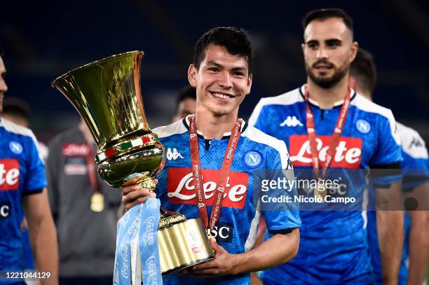 Hirving Lozano of SSC Napoli celebrates with the trophy during the awards ceremony at end of the Coppa Italia final football match between SSC Napoli...