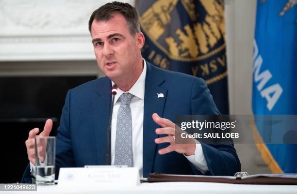 Oklahoma Governor Kevin Stitt speaks during a roundtable discussion with US President Donald Trump about economic reopening of closures due to...