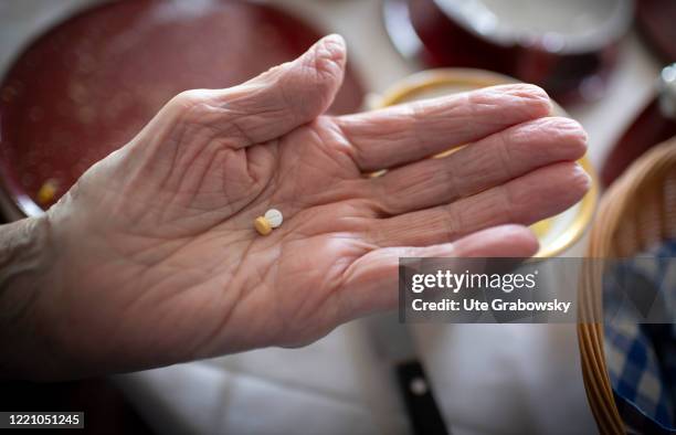 In this photo illustration an old woman is taking her medicine on June 11, 2020 in Bonn, Germany.