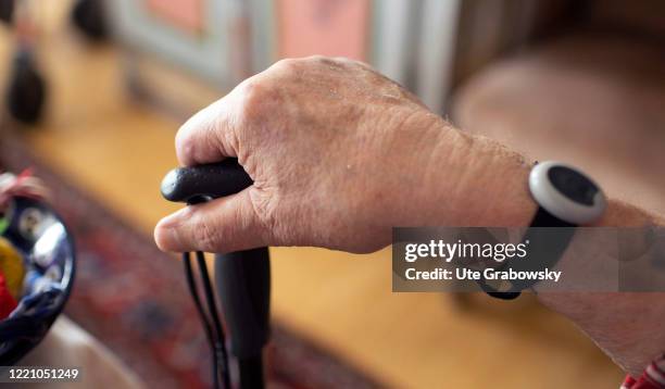 In this photo illustration an old man holds a stick in his hand on June 11, 2020 in Bonn, Germany.