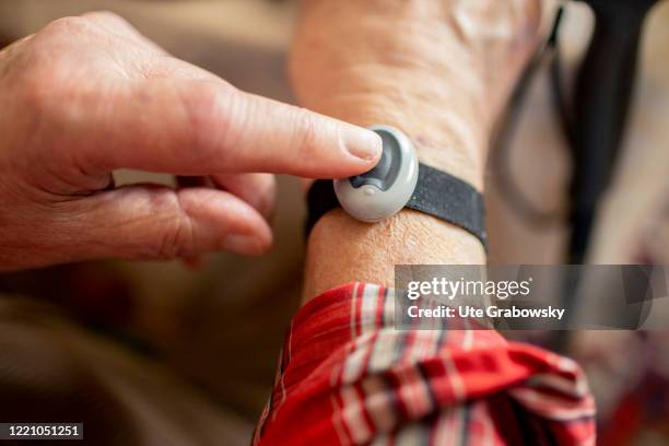 In this photo illustration an old man presses an emergency button on June 11, 2020 in Bonn, Germany.