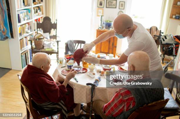 In this photo illustration a nurse helps his patients with breakfast on June 11, 2020 in Bonn, Germany.