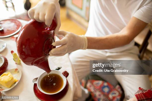 In this photo illustration a nurse helps his patients with breakfast on June 11, 2020 in Bonn, Germany.