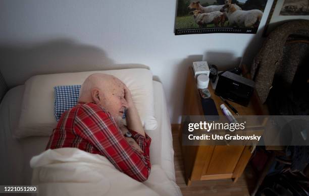 In this photo illustration an old man is sleeping on June 11, 2020 in Bonn, Germany.