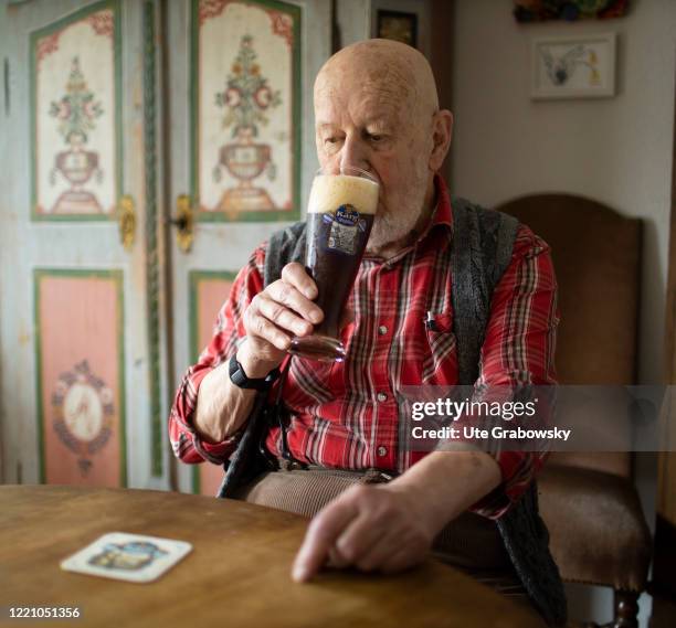 In this photo illustration an old man is drinking an bavarian beer on June 11, 2020 in Bonn, Germany.