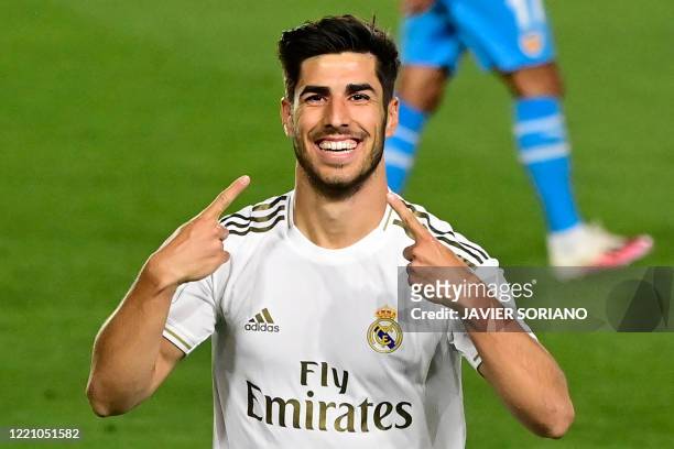 Real Madrid's Spanish midfielder Marco Asensio celebrates his goal during the Spanish league football match between Real Madrid CF and Valencia CF at...