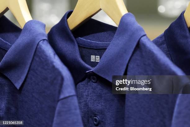 The Uniqlo logo is seen on a DRY-EX polo shirt, made of recycled polyester from reprocessed pet bottles, during a media tour of the Uniqlo Tokyo...