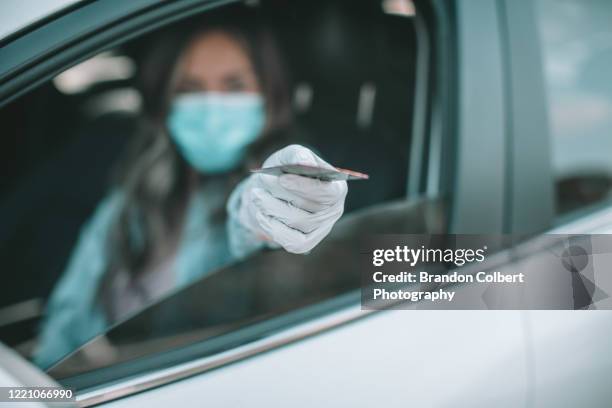 drive through during pandemic.covid-19 - forbidden coronavirus stock pictures, royalty-free photos & images