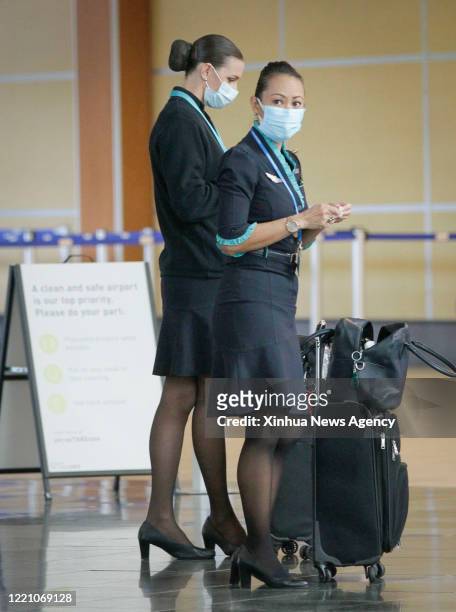 June 18, 2020 -- Flight attendants are seen wearing masks at Vancouver International Airport in Vancouver, British Columbia, Canada, on June 18,...