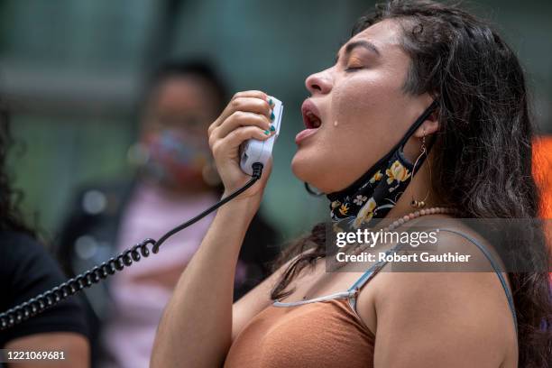 Los Angeles, CA, Thursday, June 18, 2020 - Claudia Rueda cries as she denounces ICE and a capitalist system that victimizes people of color as DACA...