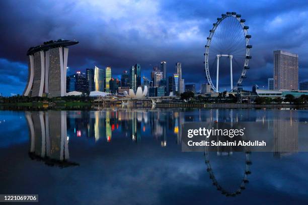 General view of the Marina Bay Sands, the ArtScience Museum, the Singapore Flyer and the central business district on June 19, 2020 in Singapore....