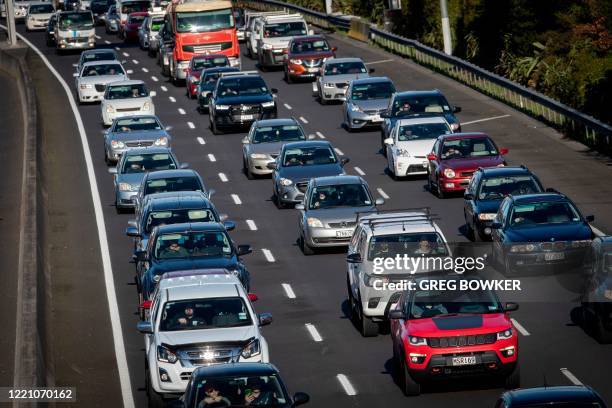 Afternoon traffic is seen after an ease in social restrictions due to the COVID-19 coronavirus pandemic in Auckland on June 19, 2020. - New Zealand's...