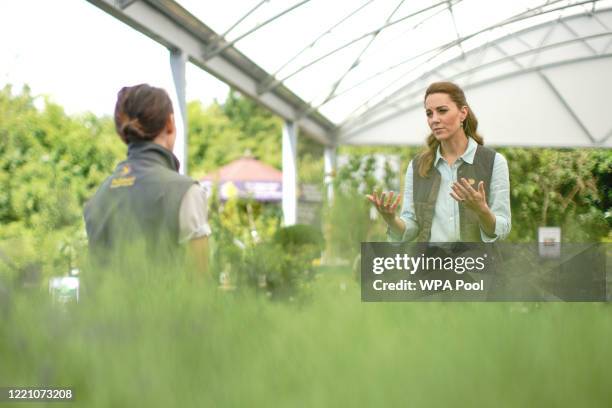 Catherine, Duchess of Cambridge talks to members of staff at Fakenham Garden Centre in Norfolk during her first public engagement since lockdown, on...