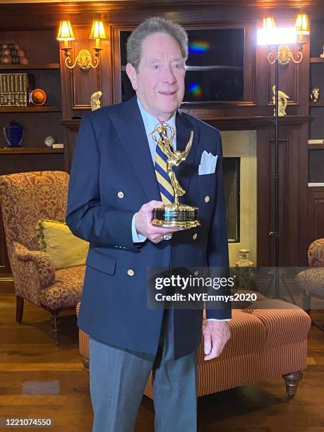 In this screengrab, John Sterling recieves the NY NATAS Governor's award on camera during a livestream for the 63rd Annual Emmy Awards on April 25,...