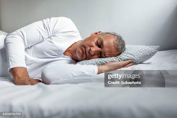 the simple pleasure of sleep - lying on side stock pictures, royalty-free photos & images