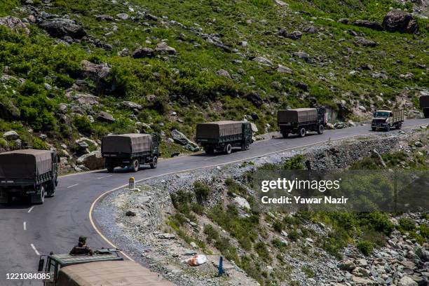 An Indian army convoy drives towards Leh, on a highway bordering China, on June 19, 2020 in Gagangir, India. As many as 20 Indian soldiers were...