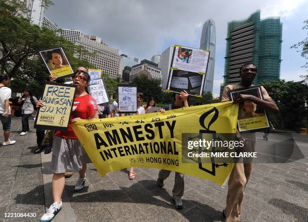 Protestors from human rights group Amnesty International protest outside the Chinese Ministry of Foreign Affairs in Hong Kong on May 21, 2009. The...