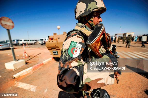 An Algerian soldier stands guard at the Tiguentourine gas complex, in In Amenas, about 1,600 kilometres southeast of the capital on January 31, 2013....