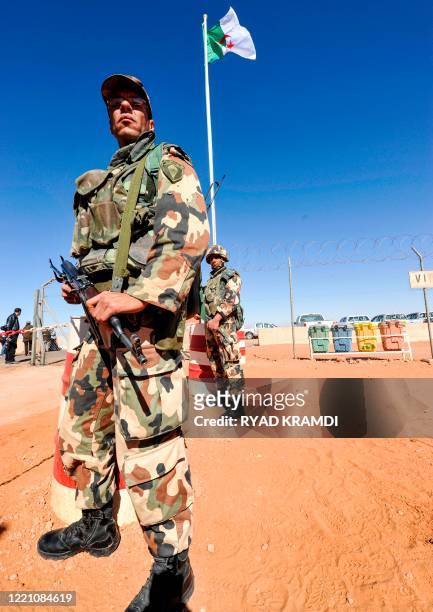 An Algerian soldier stands guard at the Tiguentourine gas complex, in In Amenas, about 1,600 kilometres southeast of the capital on January 31, 2013....