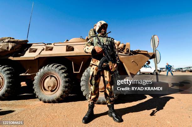 An Algerian soldier stands guard at the Tiguentourine gas complex, in In Amenas, about 1,600 kilometres southeast of the capital on January 31, 2013....