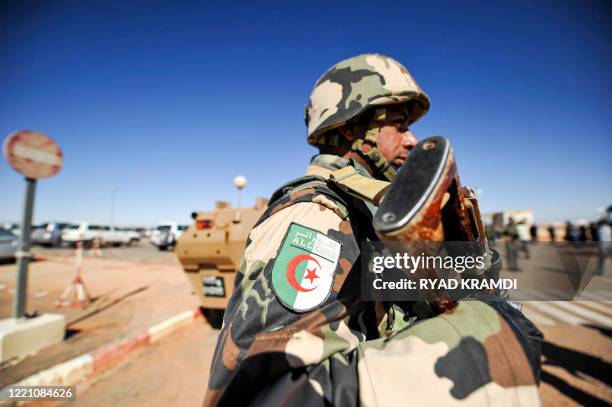 An Algerian soldier stands guard at the Tiguentourine gas complex, in In Amenas, about 1,600 kilometres southeast of the capital on January 31, 2013....