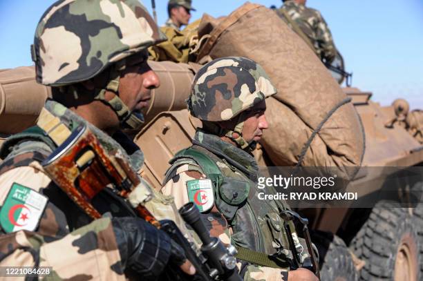 Algerian soldiers stand guard at the Tiguentourine gas complex, in In Amenas, about 1,600 kilometres southeast of the capital on January 31, 2013. -...