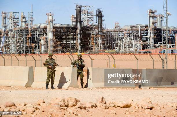 Algerian soldiers stand guard at the Tiguentourine gas complex, in In Amenas, about 1,600 kilometres southeast of the capital on January 31, 2013. -...