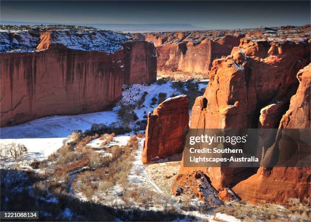 a winter coating of fresh snow covers the landscape at canyon de chelly national monument, in northeastern arizone, usa. - canyon de chelly national monument stock pictures, royalty-free photos & images