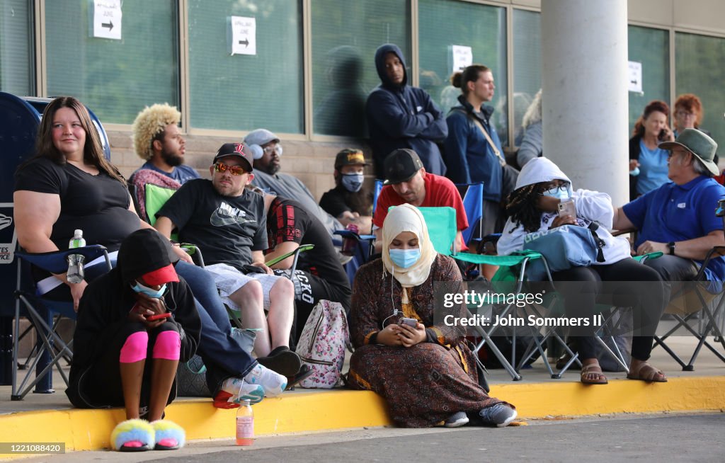 People Wait In Line To File For Unemployment Benefits In Frankfort, Kentucky