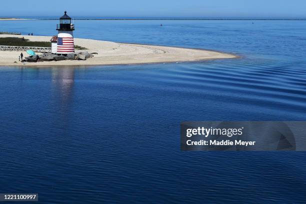 View the Brant Point Lighthouse on April 25, 2020 in Nantucket, Massachusetts. The local government is discouraging visitors and seasonal residents...