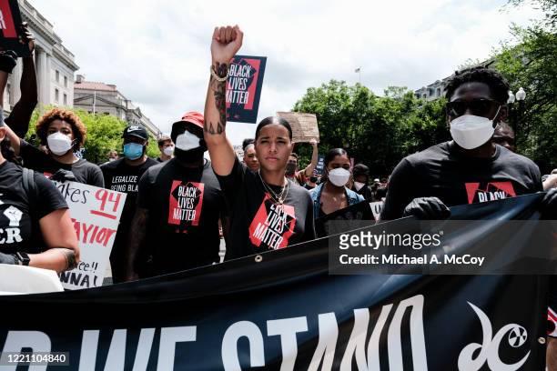Natasha Cloud marches to the MLK Memorial to support Black Lives Matter and to mark the liberation of slavery on June 19, 2020 in Washington, DC....