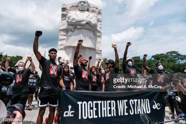Members of the Washington Wizards and Washington Mystics basketball teams rally at the MLK Memorial to support Black Lives Matter and to mark the...