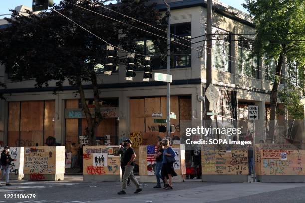 Seattle's abandoned East Precinct police station is seen surrounded by barricades in the so-called Capitol Hill Autonomous Zone. An area in Seattle's...