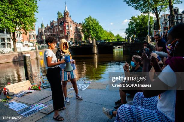 Two women making a speech during the memorial. People gathered around the Homomonument , to honour and celebrate the life and bravery of Sarah...