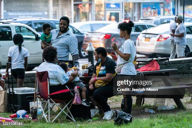 People have a picnic at Fort Greene Park in Brooklyn for both Black Lives Matter and to commemorate the 155th anniversary of Juneteenth on June 19,...