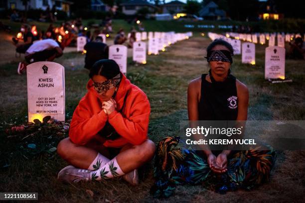 People hold their breath, some blindfolded, for 8 minutes 46 seconds, to signify the amount of time that Minneapolis police officer, Derek Chauvin...