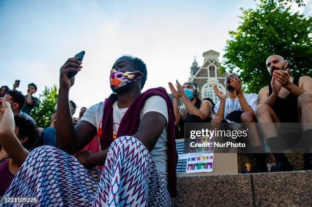 People are shouting and clapping, during the Remembrance in Memory of Sarah Hegazy, that takes place in Amsterdam, on June 19th, 2020.