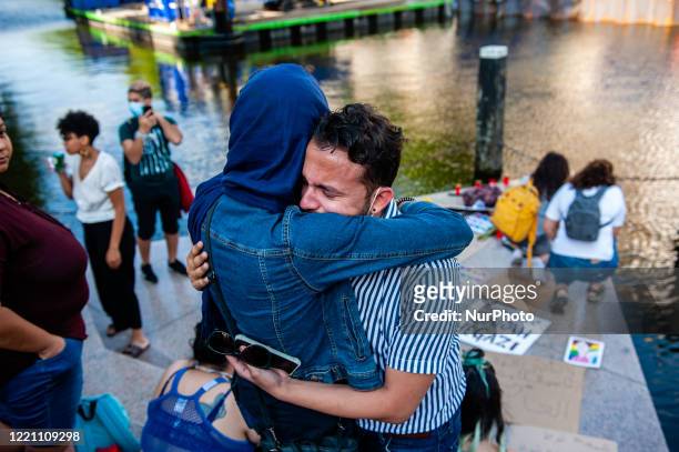 Woman and a man are holding each other while crying, during the Remembrance in Memory of Sarah Hegazy, that takes place in Amsterdam, on June 19th,...