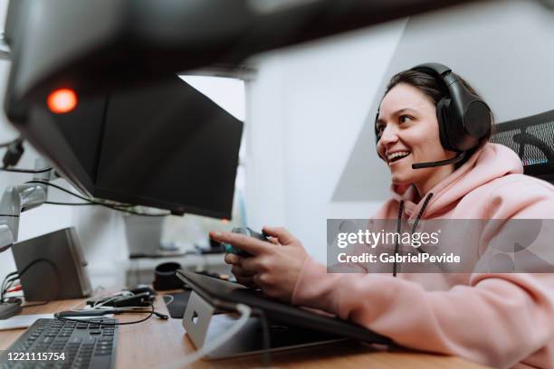 woman playing multiplayer online games - american girl alone stock pictures, royalty-free photos & images