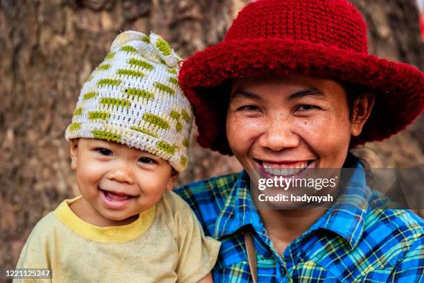 cambodian mother holding her baby, cambodia - cambodian ethnicity stock pictures, royalty-free photos & images