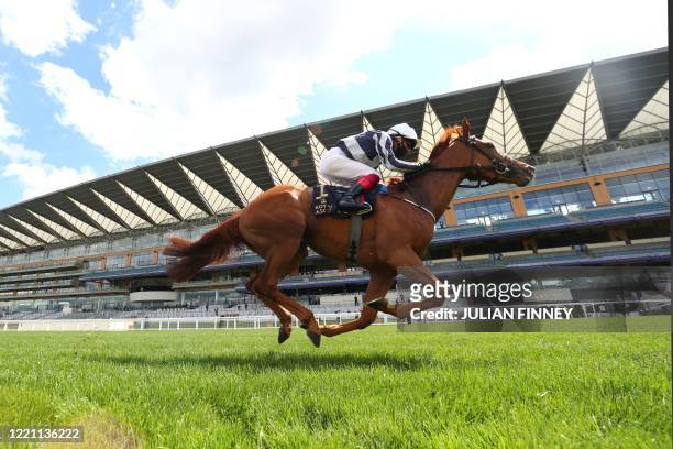 Jockey Frankie Dettori rides Alpine Star to win The Coronation Stakes on day five of the Royal Ascot horse racing meet, in Ascot, west of London, on...