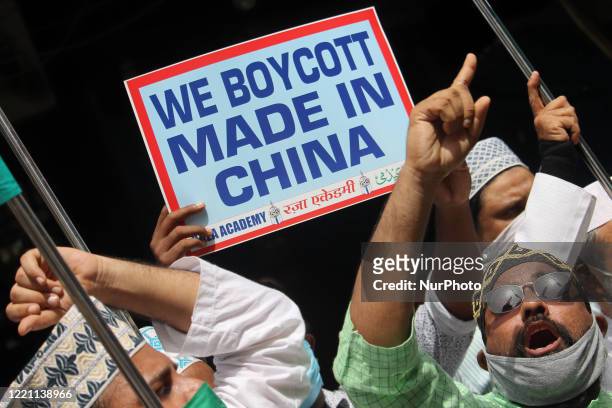 Muslim activists hold placards and shout slogans against China during a protest in Mumbai, India on June 20, 2020. The Indian Army said on Tuesday...