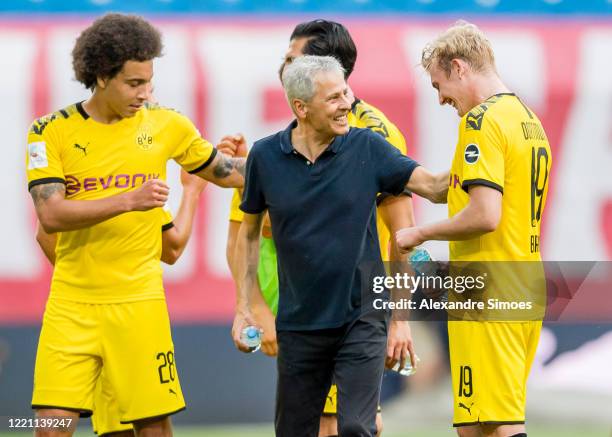Head coach Lucien Favre and Julian Brandt of Borussia Dortmund are celebrating the win after the final whistle during the Bundesliga match between RB...