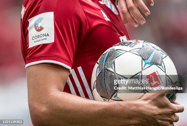 The Corona Warn-App logo seen on the jersey of Benjamin Pavard of FC Bayern München during the Bundesliga match between FC Bayern München and...