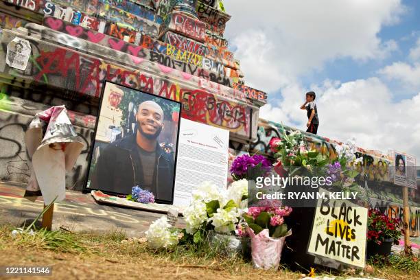 Memorial to Marcus-David Peters sits at the base of the Robert E. Lee statue on Monument Avenue in Richmond, Virginia on June 20, 2020. - Peters was...