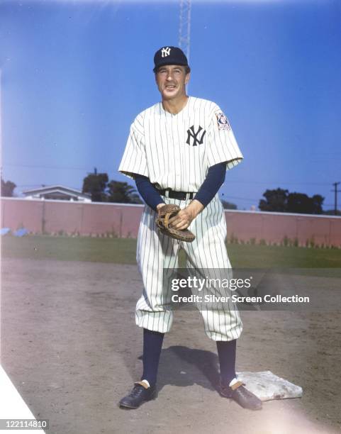 Gary Cooper , US actor, wearing a New York Yankees baseball kit and a baseball glove in a publicity portrait issued for the film, 'The Pride of the...