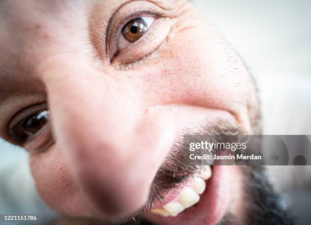 extreme close up portrait of quirky laughing man - fish eye lens stock pictures, royalty-free photos & images