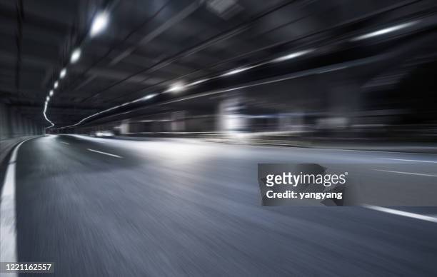 the tunnel at night - underpass stock pictures, royalty-free photos & images