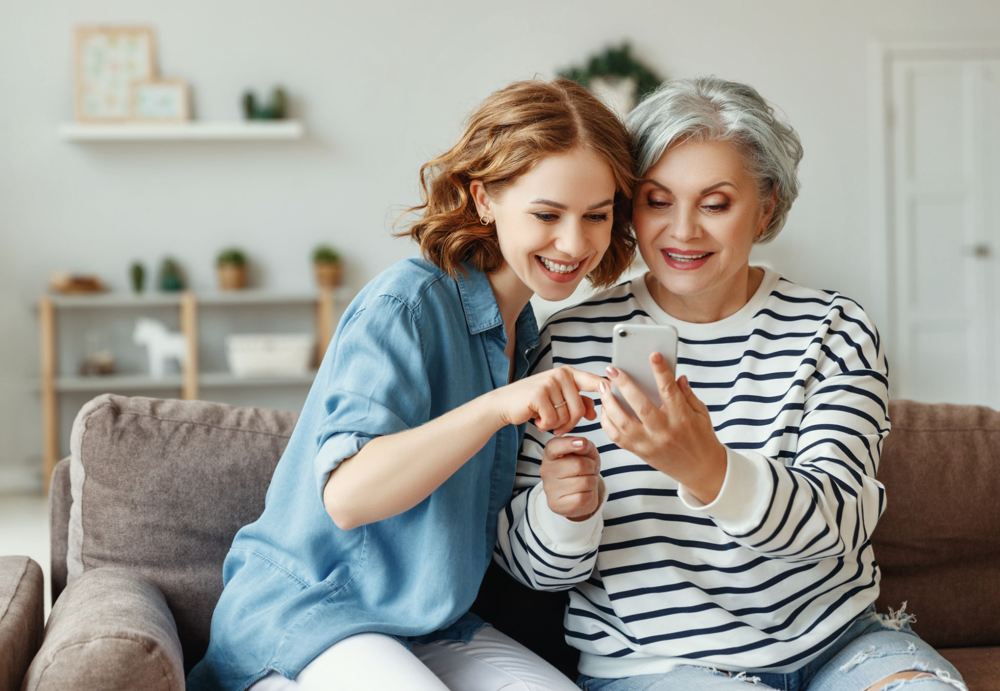 family using smartphone