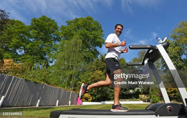 Former Southampton FC player and current club ambassador Francis Benali, runs the distance of a marathon on a treadmill in his garden at his home, as...